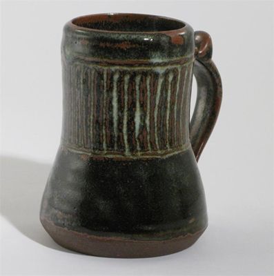 Appraisal: Ladi Kwali - an Abuja stoneware tankard strap handle glazed