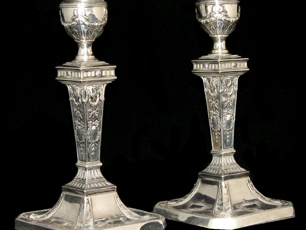 Appraisal: Pair of Edwardian neo-classical style candlesticks of square tapering form