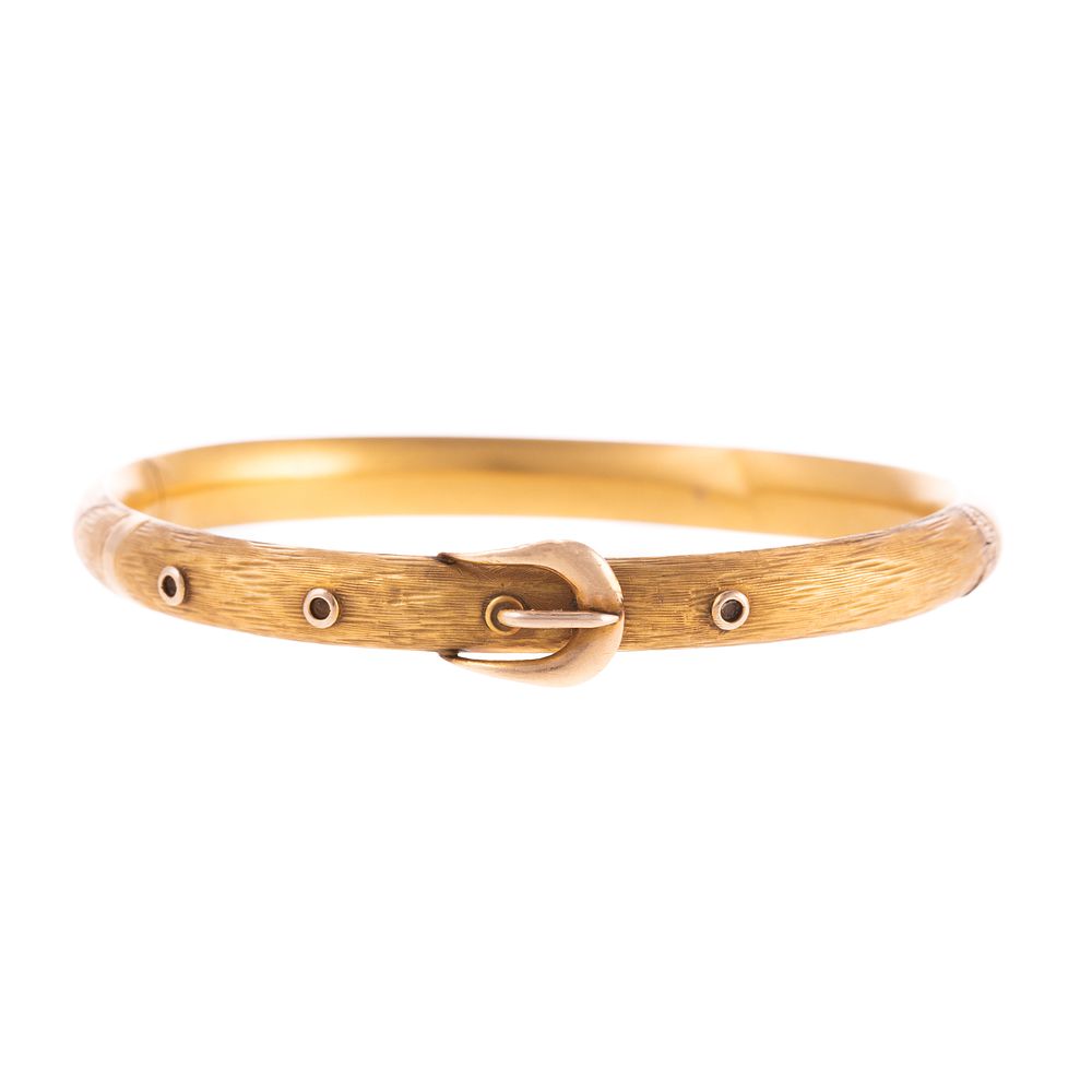 Appraisal: A Textured Gold Buckle Bangle Bracelet K yellow gold textured