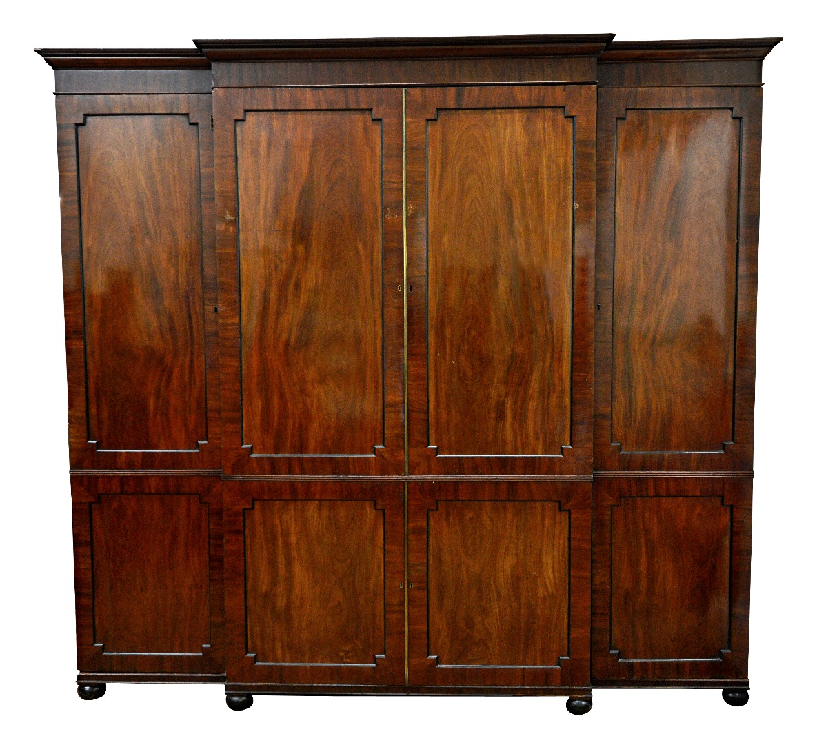 Appraisal: A Regency mahogany breakfront wardrobe the moulded cornice above three