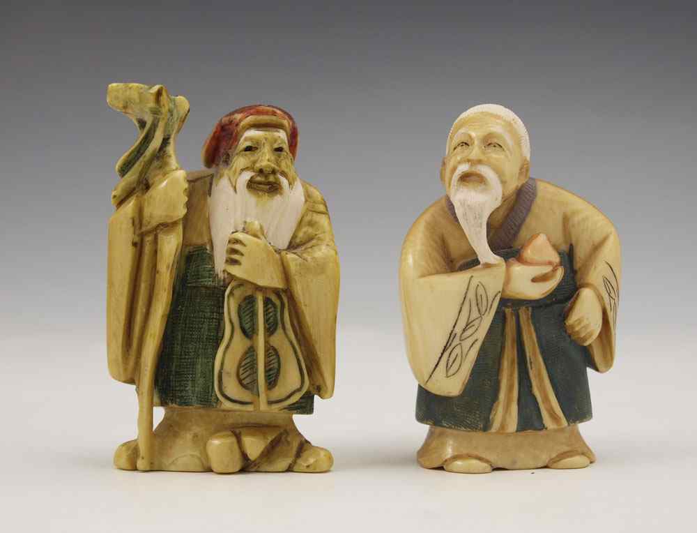 Appraisal: PIECE CARVED IVORY TINTED FIGURES NETSUKE To include Elderly man