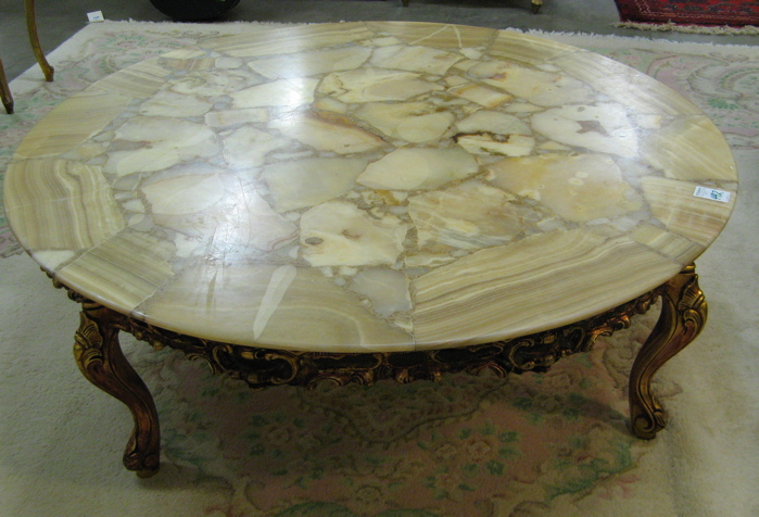 Appraisal: ROUND ONYX AND GILTWOOD COFFEE TABLE th century having a