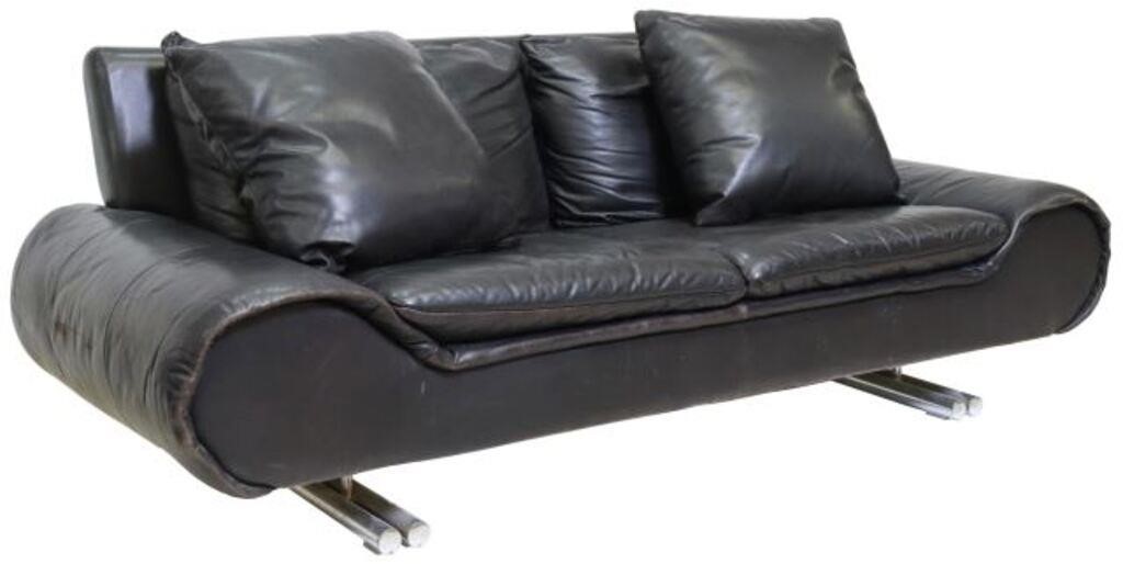 Appraisal: Modern black leather two-seat sofa th c cushion back and