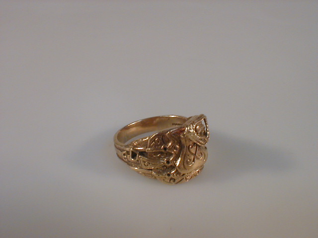 Appraisal: A gentleman's ct gold signet ring as a Western saddle