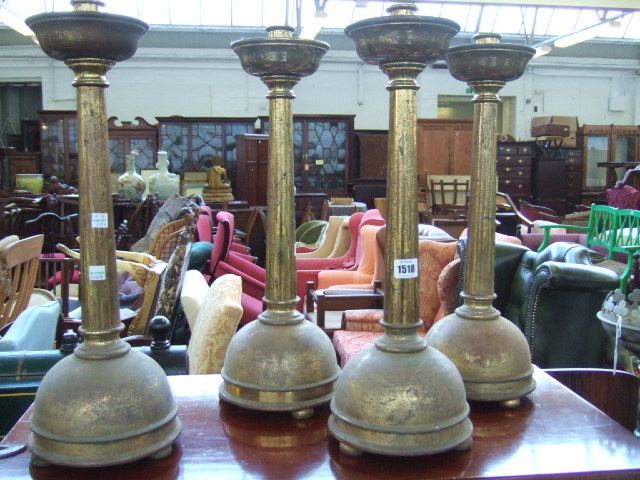 Appraisal: A set of four English brass altar candlesticks early th