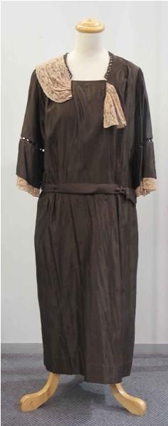 Appraisal: Dinner dress in embroidered dark brown silk with cafe au