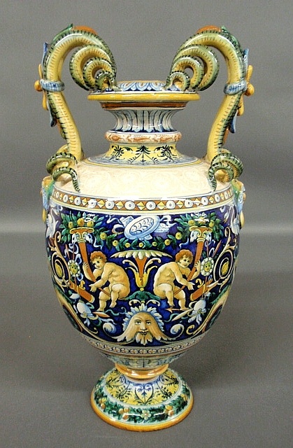 Appraisal: - Colorful Italian faience urn with serpent-form and mask handles