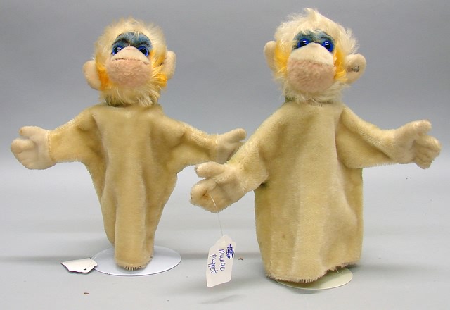 Appraisal: Pair of Mungo monkey hand puppets Mohair bodies with blue