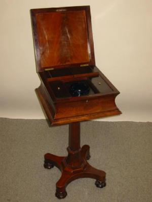 Appraisal: AN EARLY VICTORIAN MAHOGANY TEAPOY of square form with hinged