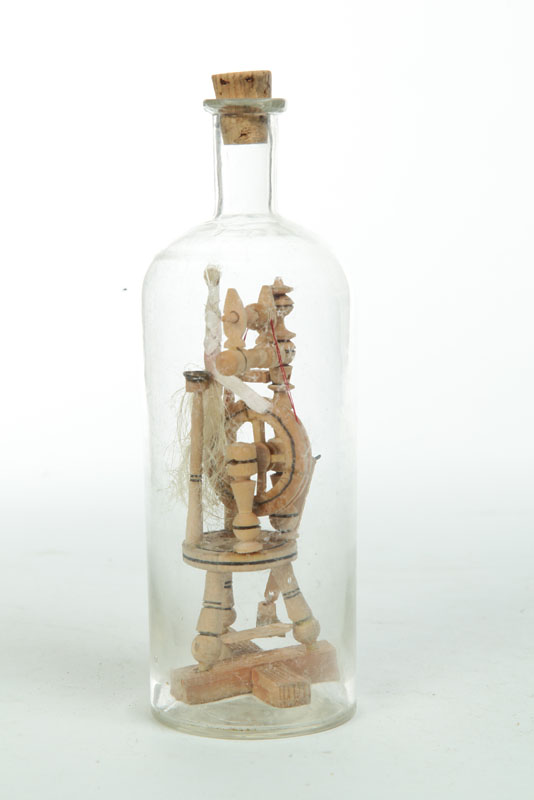 Appraisal: BOTTLE WHIMSEY Eastern European glass and wood Detailed spinning wheel