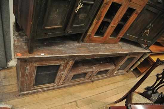 Appraisal: A RUSTIC INDIAN SIDEBOARD WITH WIRE DOOR FEATURE