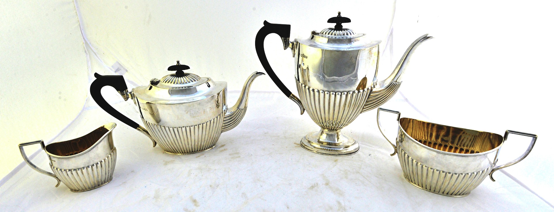 Appraisal: A silver four piece tea and coffee set comprising a