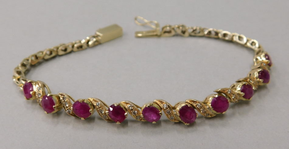 Appraisal: A ruby and diamond bracelet with ten rubies and various