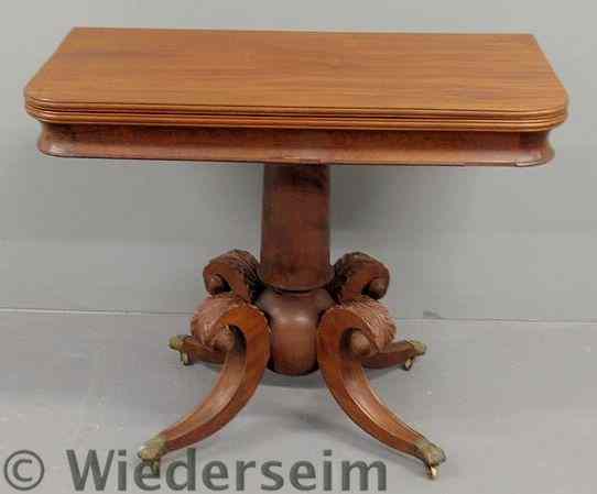 Appraisal: Empire mahogany card table with a rotating top cylindrical shaft