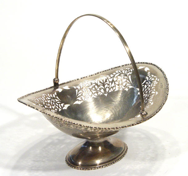 Appraisal: Oval pierced silver footed basket with swing handle Chester cm