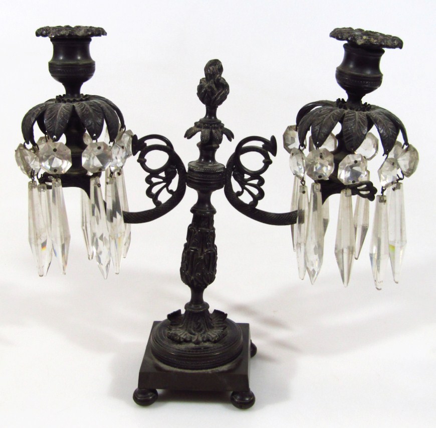 Appraisal: A Regency bronze candelabra centrepiece with shaped centre set with