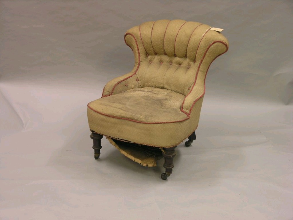 Appraisal: A small Victorian walnut-framed nursing chair on front turned legs