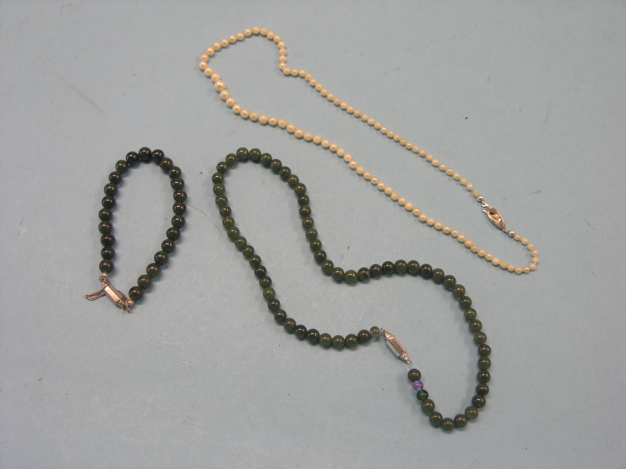 Appraisal: A jade-type bead necklace matching bracelet and a pearl-type necklace