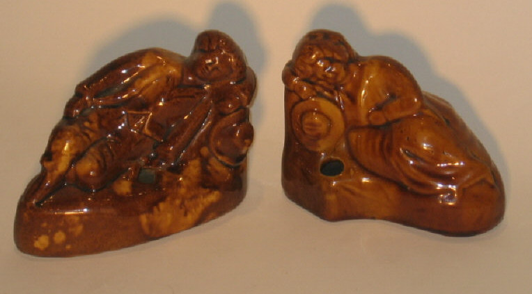 Appraisal: PAIR OF AMERICAN TH CENTURY POTTERY FIGURES Brown glazed in