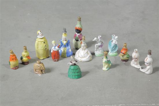 Appraisal: FIFTEEN FIGURAL PERFUME BOTTLES Including two seated Kewpie bottles one