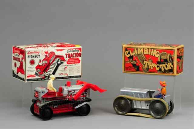 Appraisal: LOT OF TWO MARX BOXED FARM TRACTORS Includes Highboy climbing