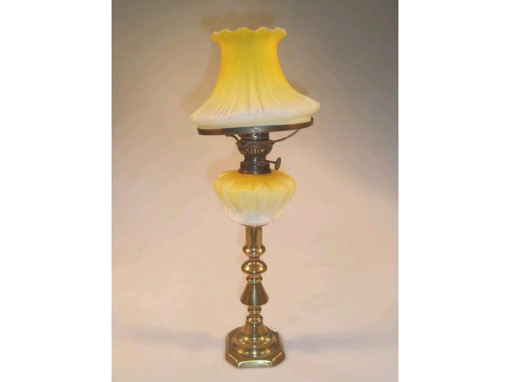 Appraisal: A Victorian candlestick oil lamp the brass column supporting a