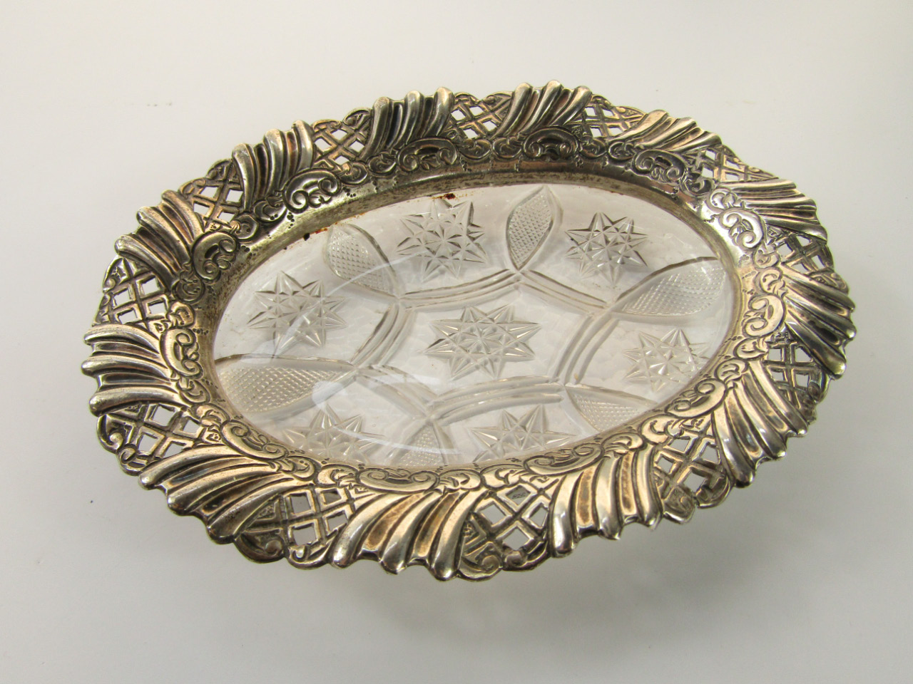 Appraisal: A Victorian silver and cut glass oval dish with pierced