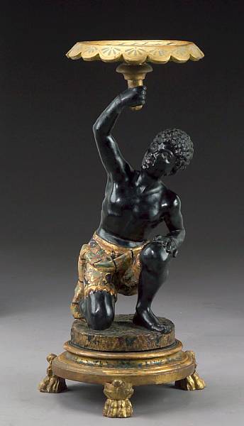 Appraisal: An Italian polychrome and parcel giltwood blackamoor stand second half