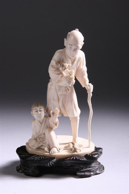 Appraisal: JAPANESE IVORY OKIMONO th century Carved depicting man holding flower