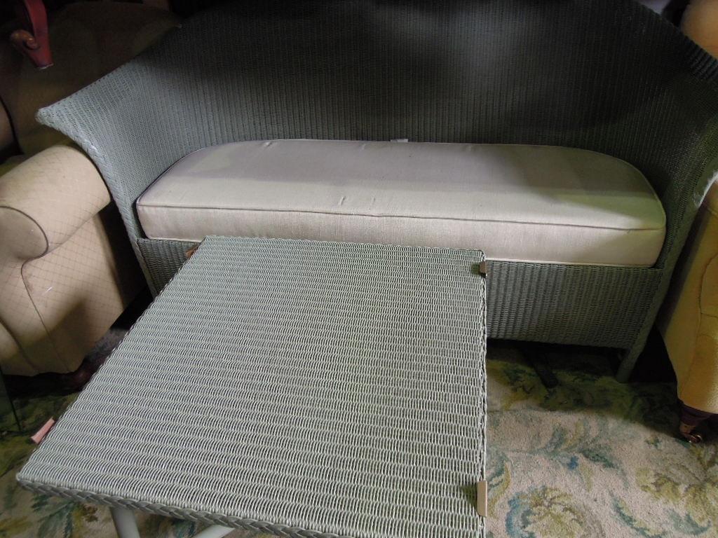 Appraisal: A modern Lloyd Loom sofa with squab cushion together with