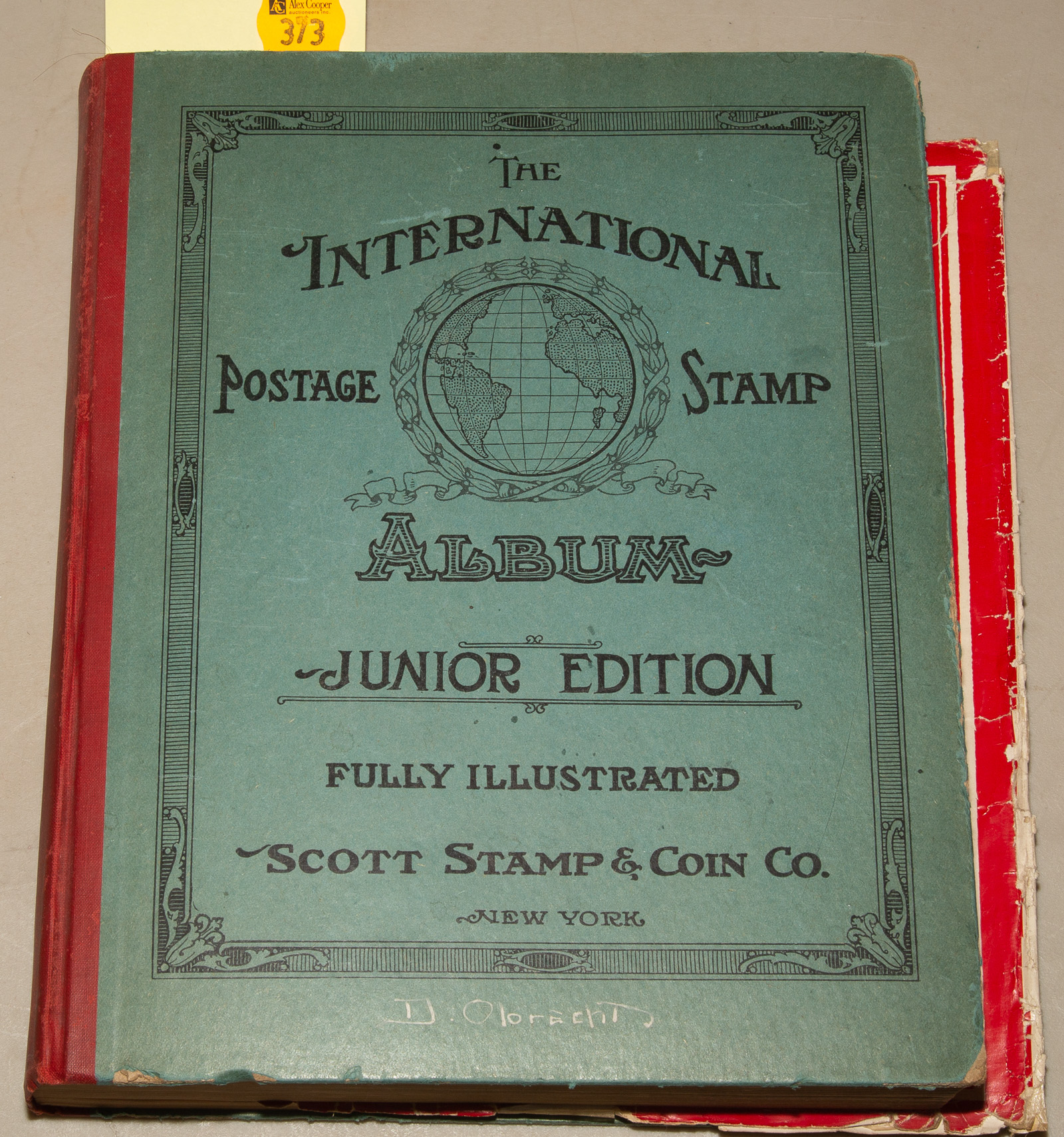 Appraisal: SCOTT'S INTERNATIONAL POSTAGE STAMP ALBUM Junior Edition containing a sampling