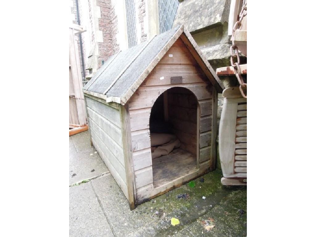 Appraisal: A weathered timber framed dog kennel with felt roof