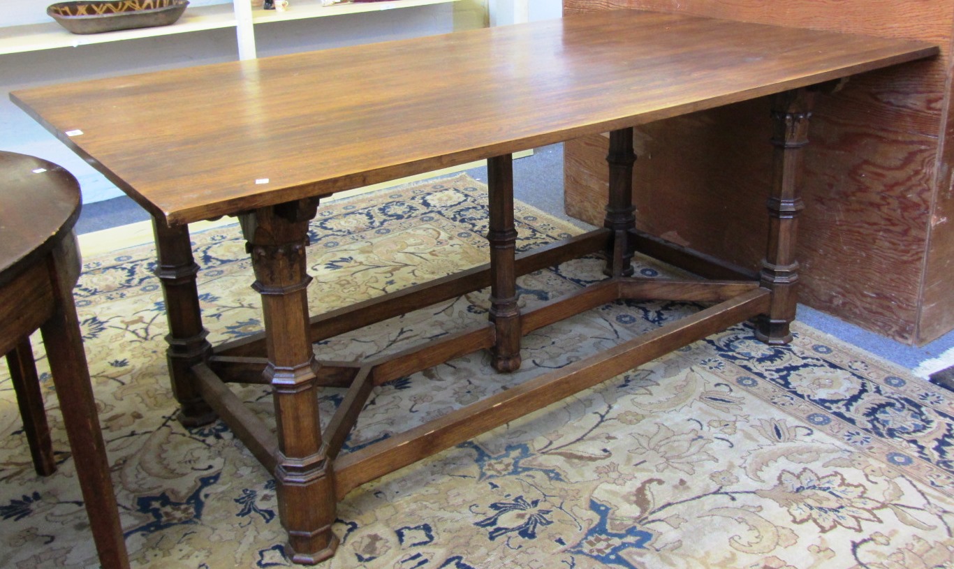 Appraisal: An oak Gothic Revival centre table on five octagonal supports