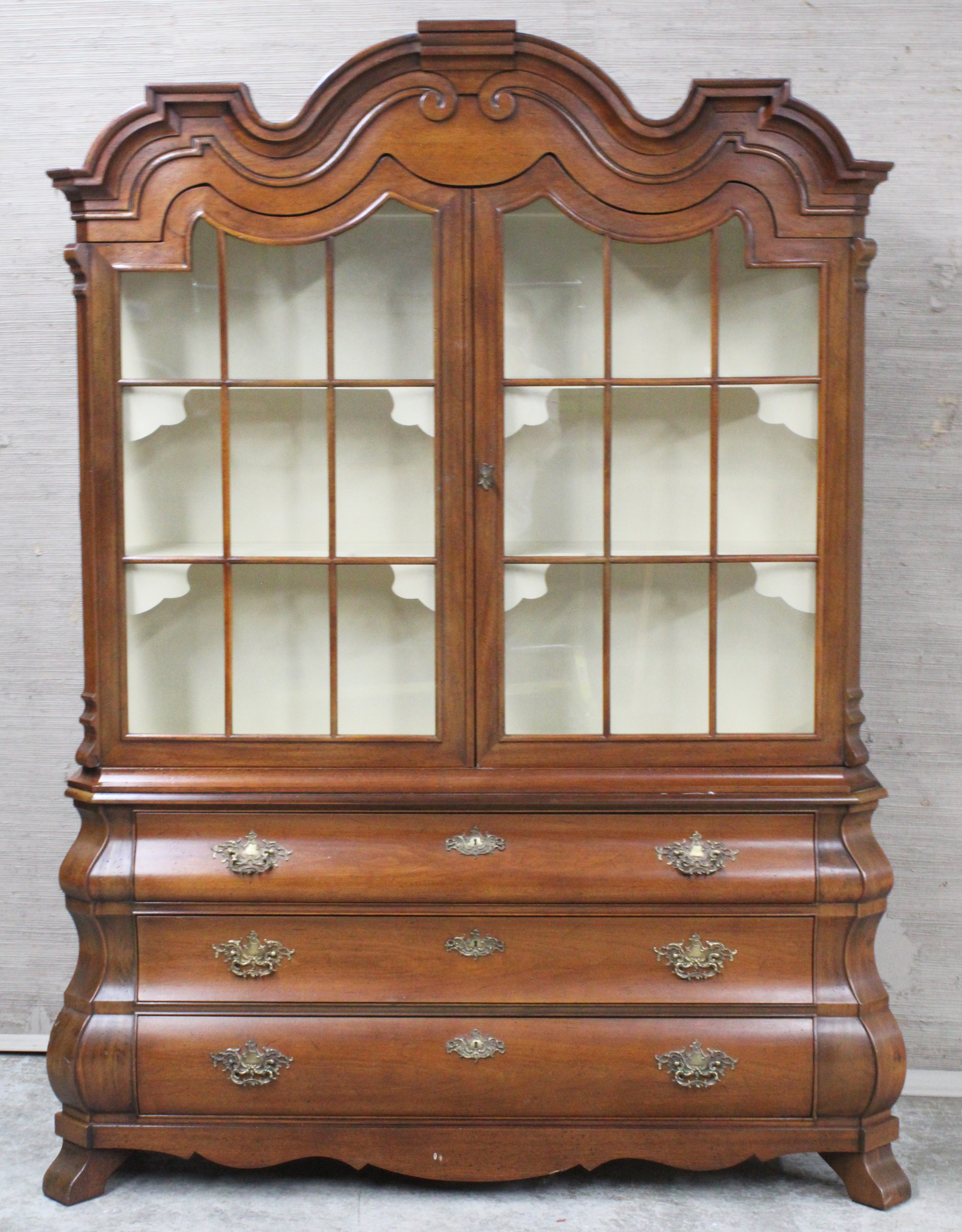 Appraisal: HENREDON CHINA CABINET Dutch style bombe china cabinet by Henredon