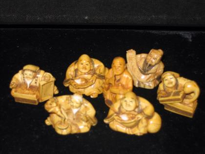 Appraisal: Seven Figural Ivory Netsuke Japanese th th c Stained and