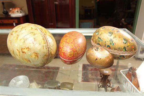 Appraisal: FOUR LARGE PAPER LITHO EGGS Decoration includes roosters chicks moons