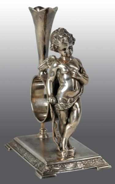 Appraisal: Standing Cupid with Bow Napkin Holder Description By Wilcox Draped