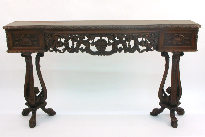 Appraisal: HIGHLY CARVED MAHOGANY AND WALNUT CONSOLE TABLE American c 's