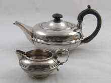 Appraisal: A matching silver teapot and cream jug of flattened globe