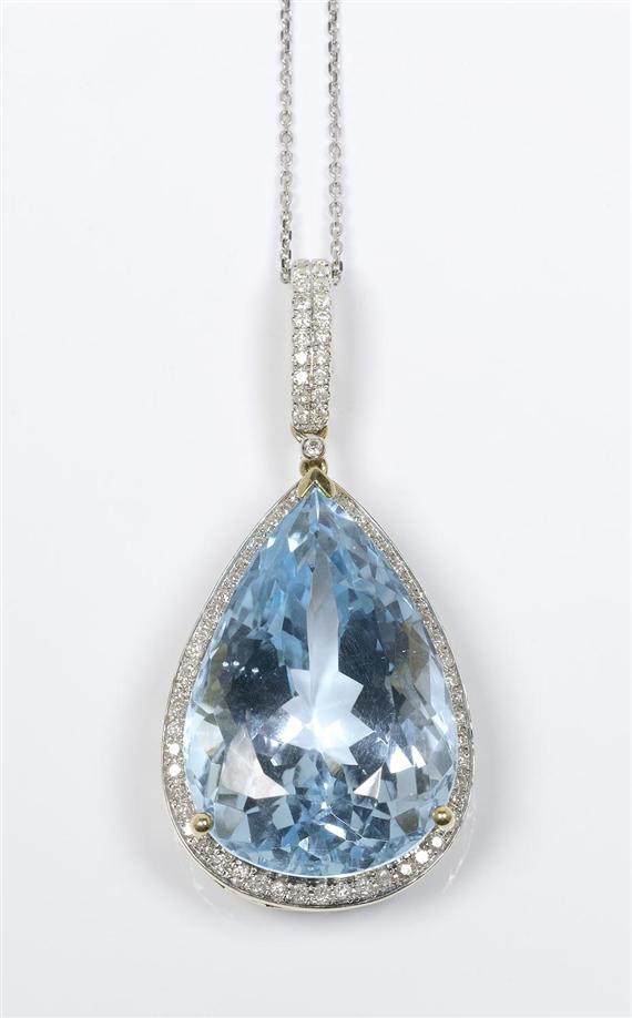 Appraisal: TOPAZ AND DIAMOND PENDANT with chain Yellow and white gold