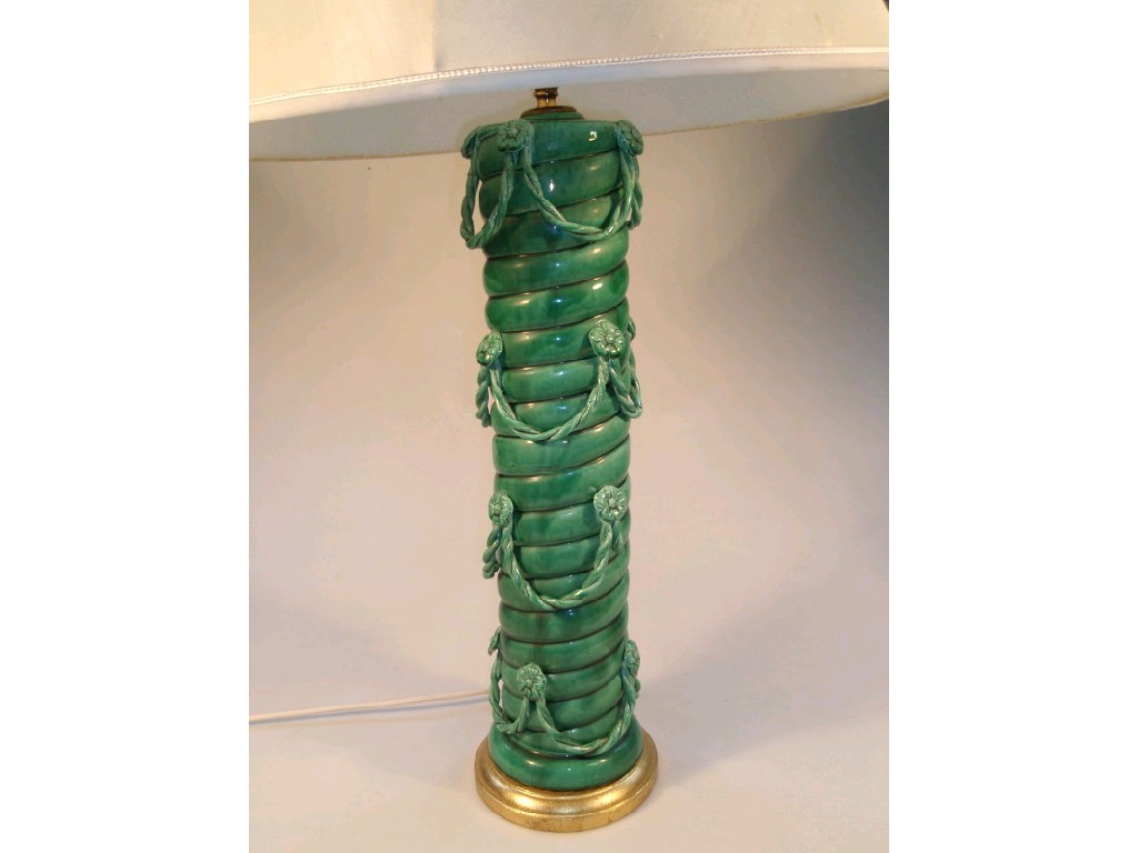 Appraisal: A green pottery table lamp the spirally fluted slender column