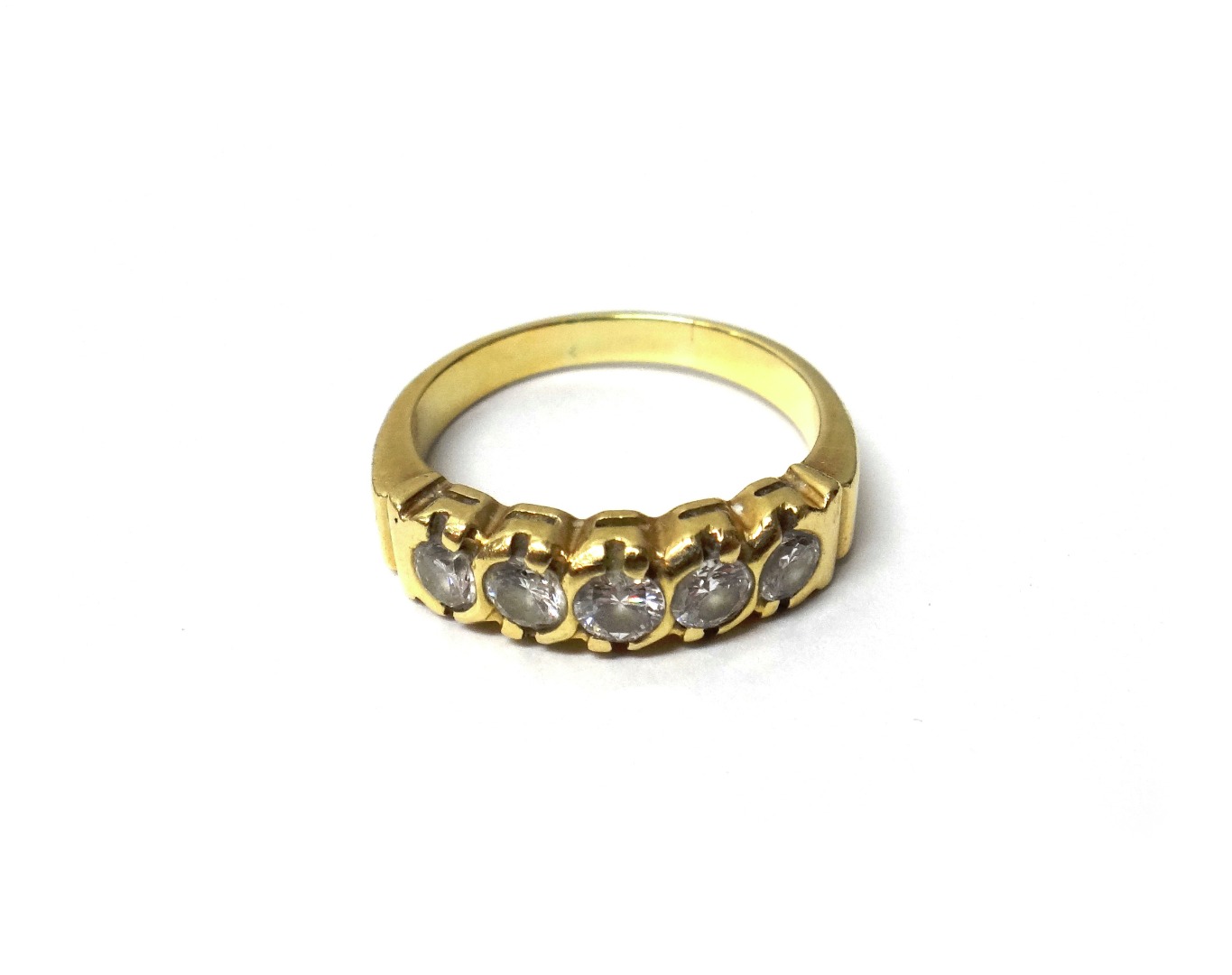 Appraisal: A gold and diamond set five stone ring mounted with