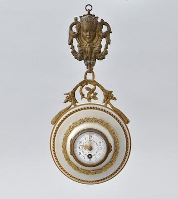 Appraisal: A French Alabaster and Gilt Hanging Clock with Brass Mounts