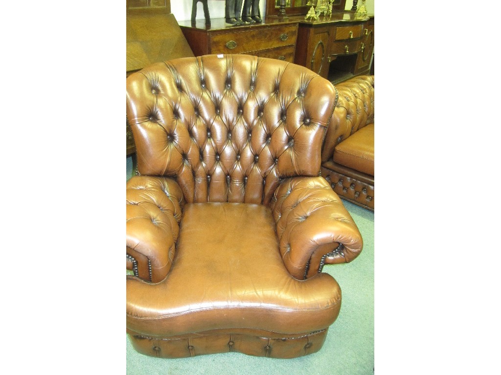 Appraisal: Brown leather button back Chesterfield settee with a pair of