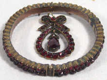 Appraisal: A Victorian garnet bangle set in yellow metal tests gold