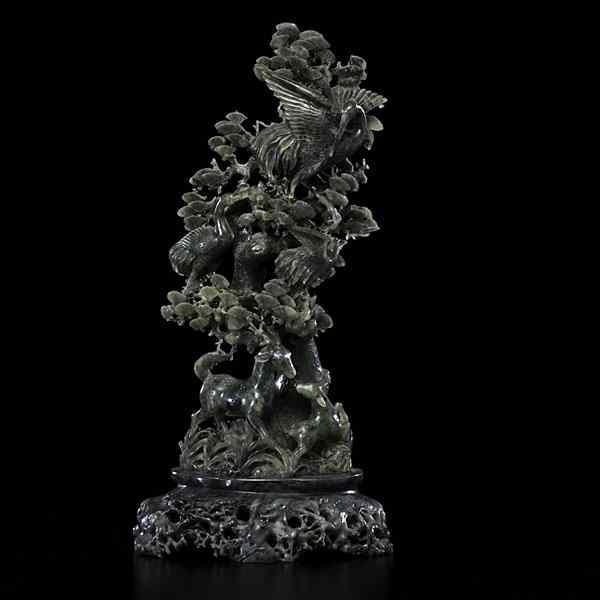 Appraisal: Chinese Bowanite and Soapstone Carving Chinese A bowanite carving depicting