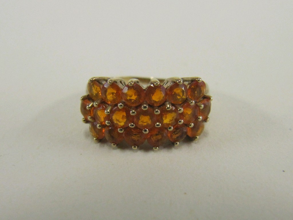 Appraisal: Nine carat gold triple row fire opal set ring