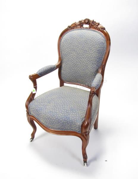 Appraisal: A carved Victorian arm chair porcelain casters carved walnut frame