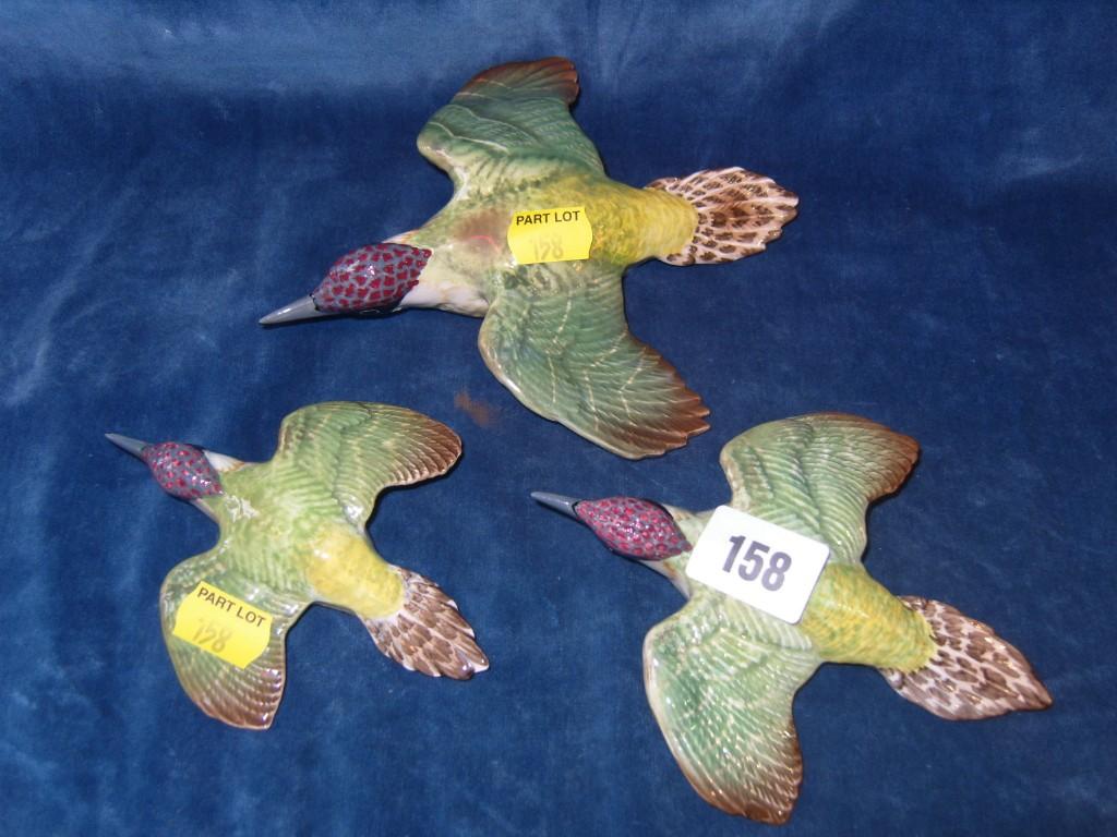 Appraisal: A set of three graduated Beswick wall plaques in the