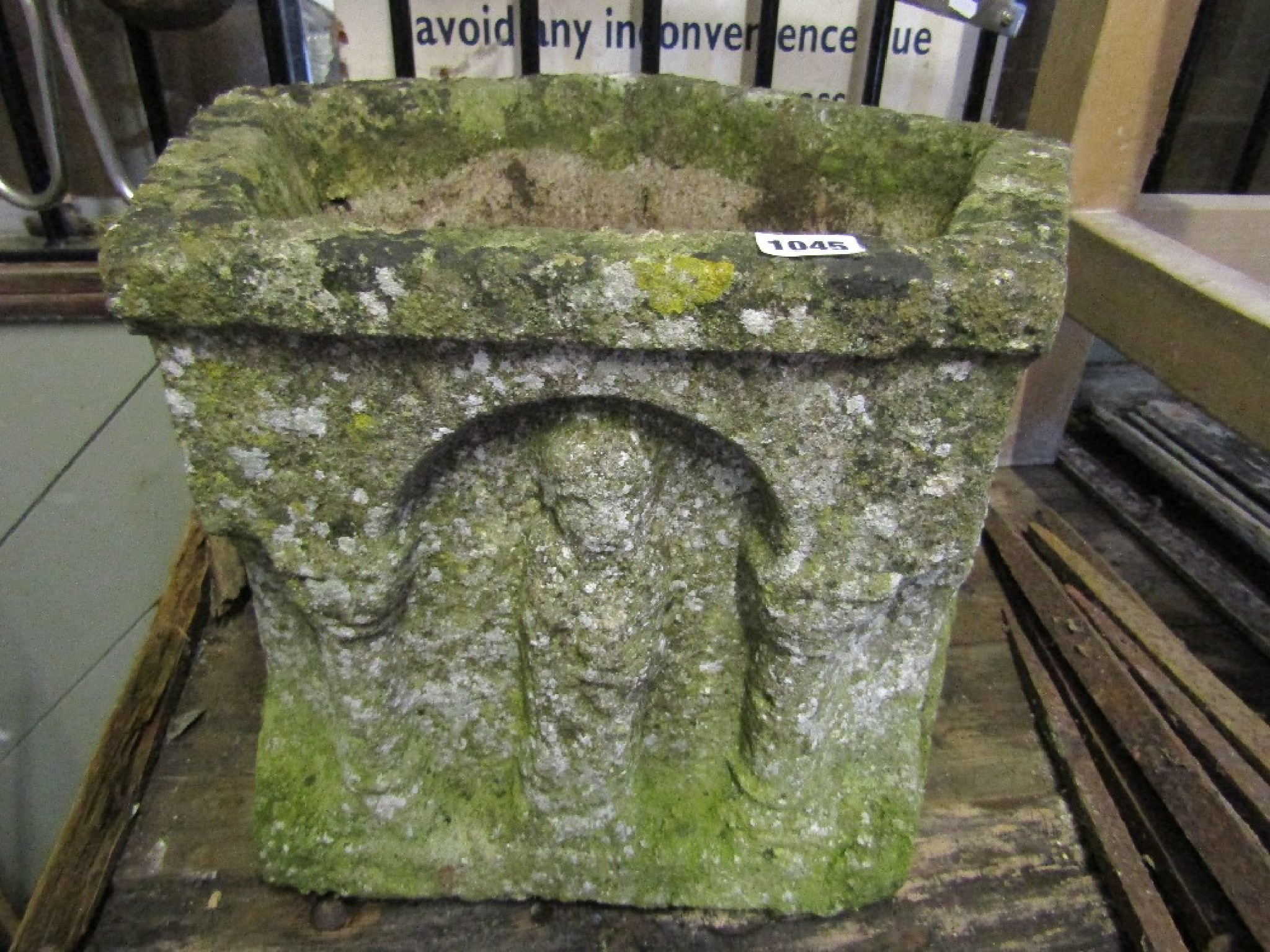 Appraisal: A weathered five sided planter the frieze with architectural columns